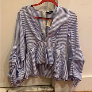 Never worn- blouse (high-low) in the front.